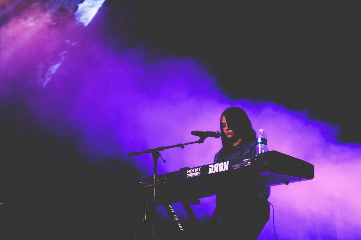musical instrument woman playing Korg electric keyboard musician